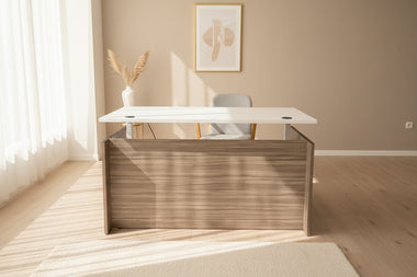 Office desk with a white top and wooden side panel in an indoor setting