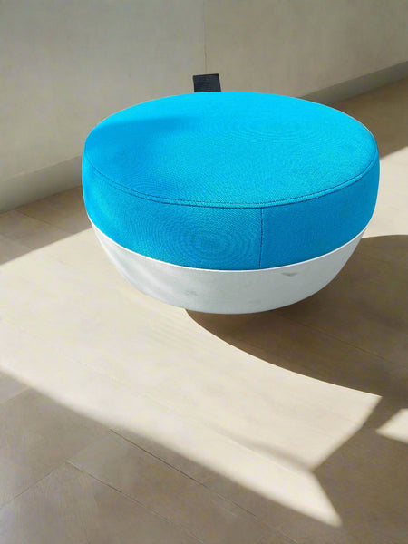 Round blue and white device on a light surface